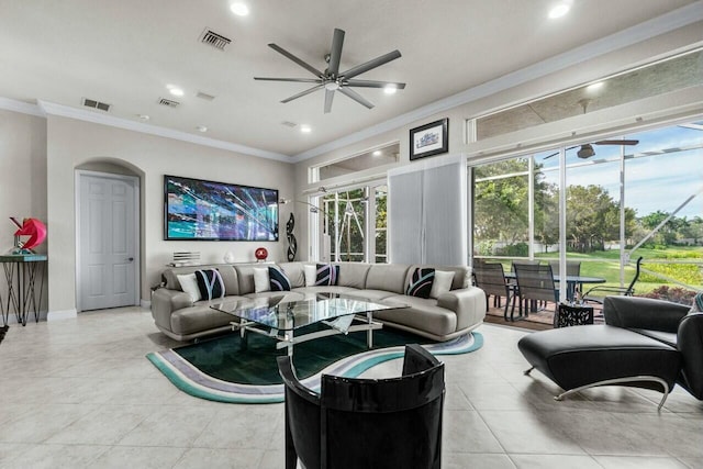 living room featuring ceiling fan and crown molding