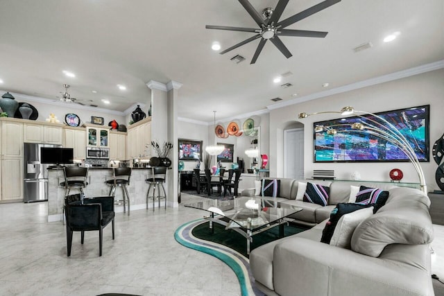 living room featuring ceiling fan and ornamental molding