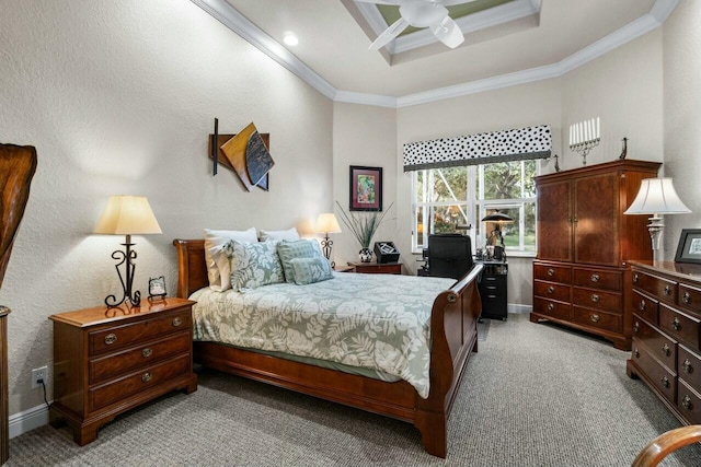 bedroom featuring ceiling fan, light carpet, a tray ceiling, and ornamental molding