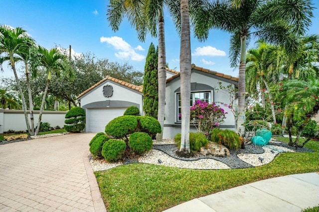 mediterranean / spanish-style home featuring a garage