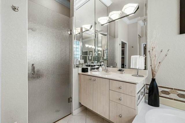 bathroom with tile patterned floors, an enclosed shower, vanity, and crown molding