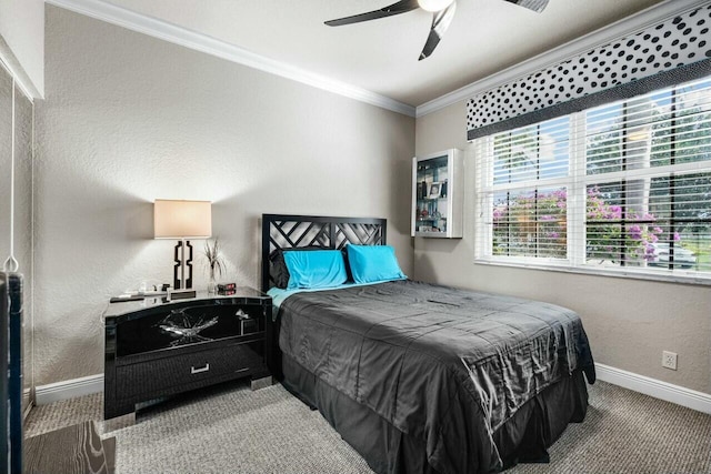 bedroom featuring ceiling fan, crown molding, and carpet flooring