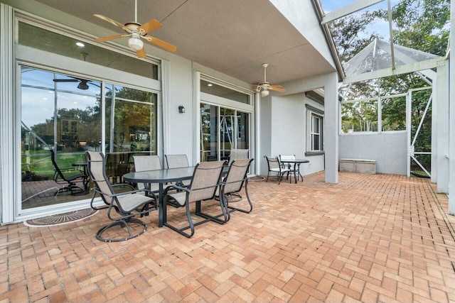 view of patio / terrace featuring a lanai and ceiling fan