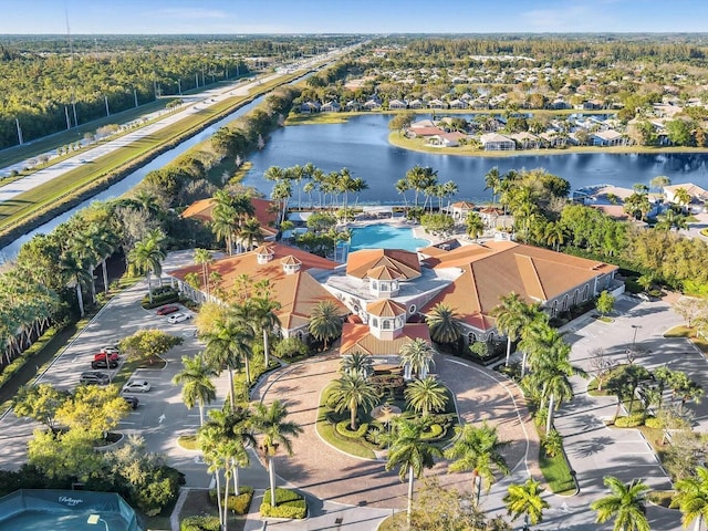 birds eye view of property with a water view