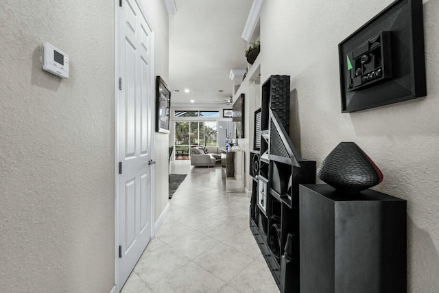 hall with light tile patterned floors