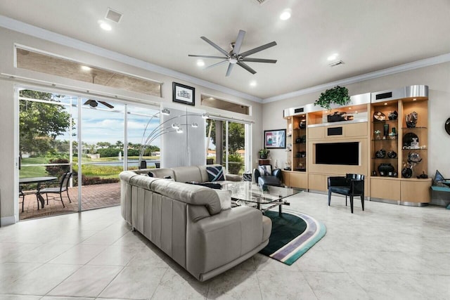 living room featuring ceiling fan, a wealth of natural light, and ornamental molding