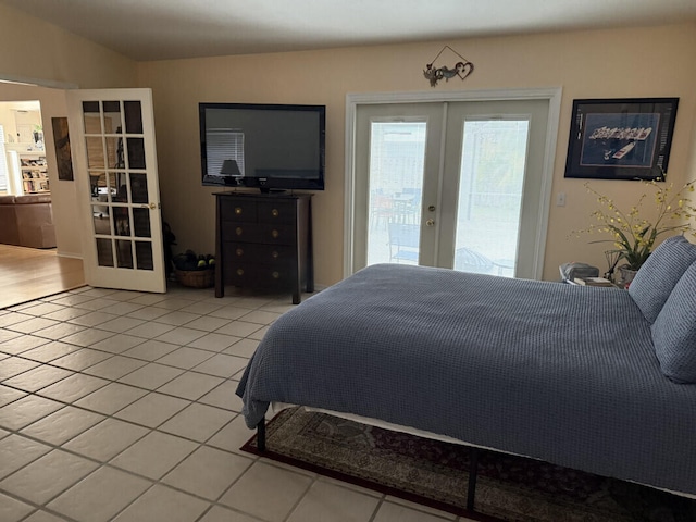 tiled bedroom featuring access to exterior and french doors