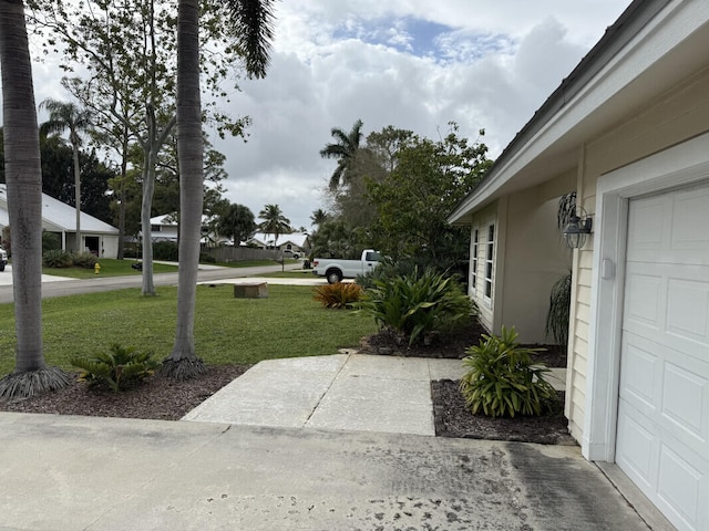 view of yard featuring a garage