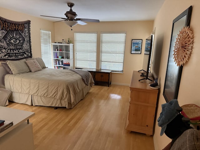 bedroom featuring light hardwood / wood-style flooring and ceiling fan