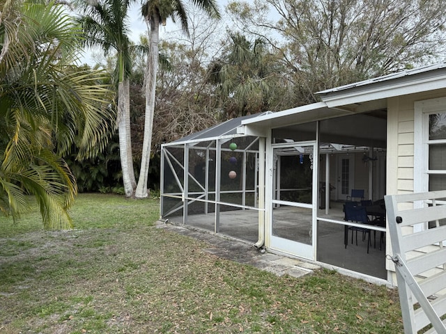 view of yard featuring glass enclosure