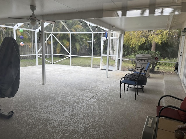 view of patio featuring ceiling fan, a grill, and a lanai