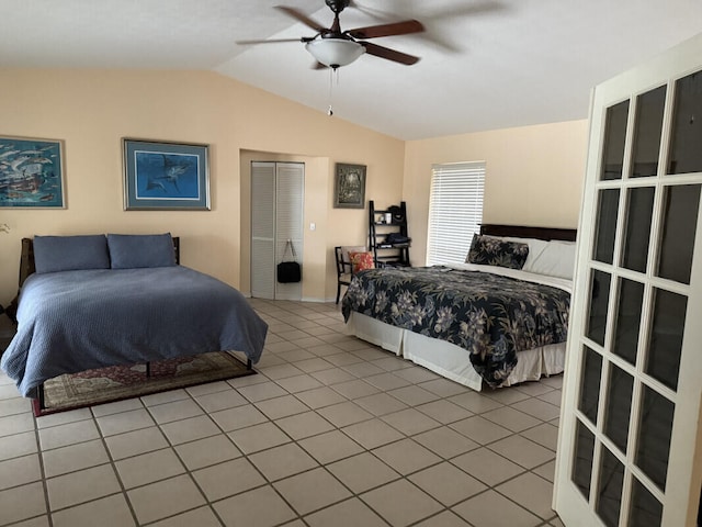 bedroom featuring ceiling fan, tile patterned floors, and vaulted ceiling