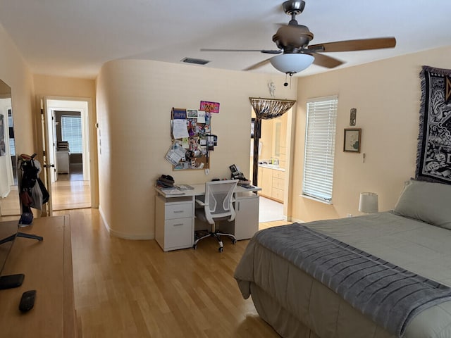 bedroom with ceiling fan and light wood-type flooring