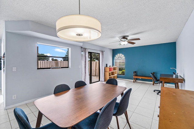 tiled dining area with ceiling fan