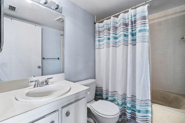 full bathroom with toilet, vanity, and shower / tub combo with curtain