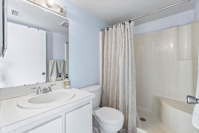 bathroom featuring a shower with curtain, vanity, and toilet