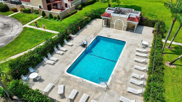 view of swimming pool with a patio area