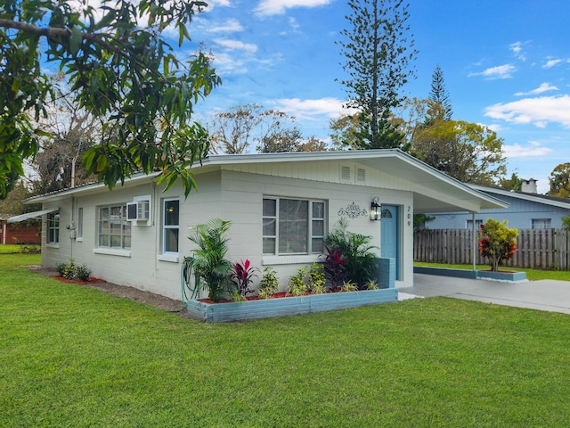 single story home featuring a front yard