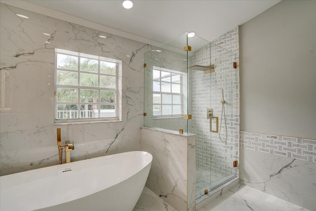 bathroom with tile walls, crown molding, and independent shower and bath