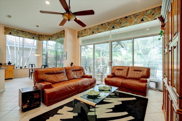 tiled living room featuring ceiling fan