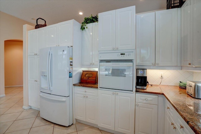 kitchen featuring white cabinetry, white appliances, and light tile patterned floors