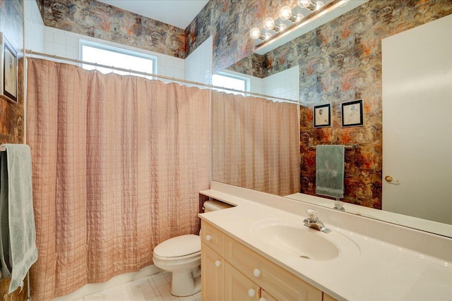 bathroom featuring curtained shower, toilet, tile patterned floors, and vanity