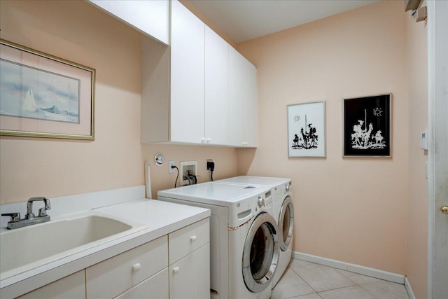 laundry area with sink, separate washer and dryer, light tile patterned floors, and cabinets