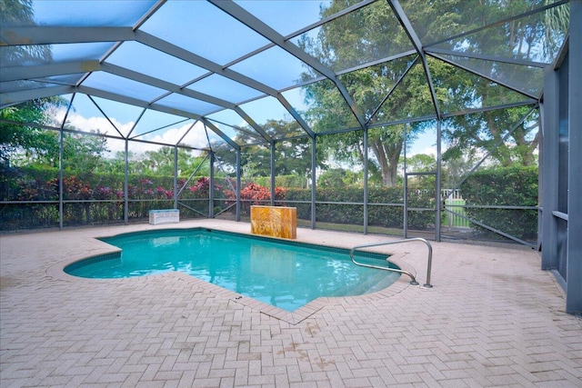 view of pool featuring a lanai and a patio