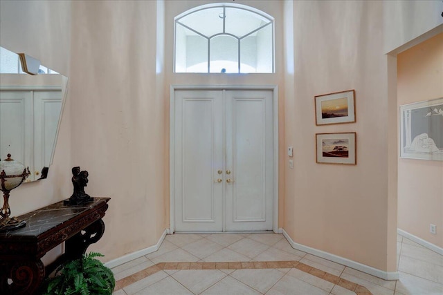 entryway with light tile patterned floors