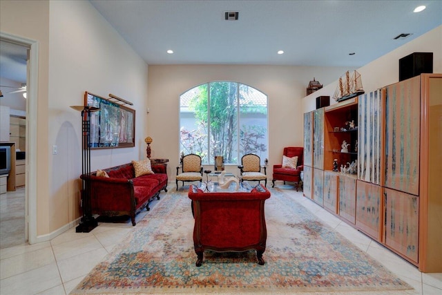 tiled living room featuring ceiling fan