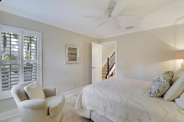 carpeted bedroom with ceiling fan and crown molding