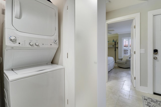 laundry room featuring stacked washer and clothes dryer