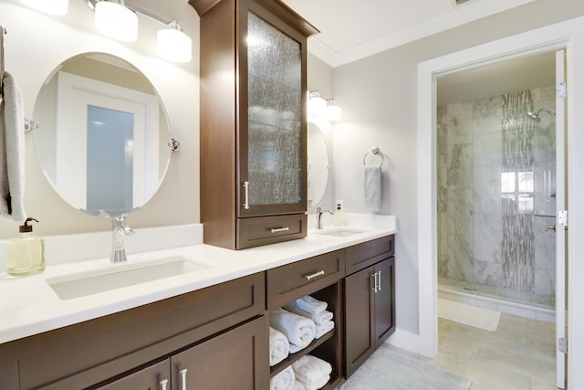 bathroom with ornamental molding, a tile shower, and vanity