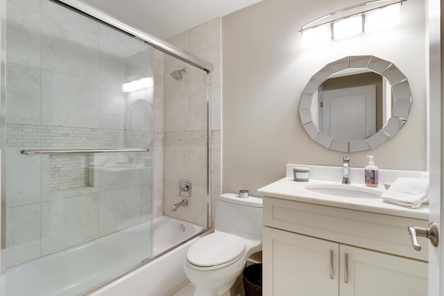 full bathroom with toilet, vanity, and enclosed tub / shower combo