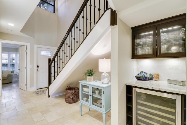 interior space featuring indoor bar and wine cooler