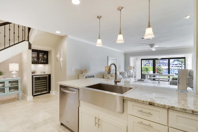 kitchen with sink, decorative light fixtures, dishwasher, ceiling fan, and wine cooler