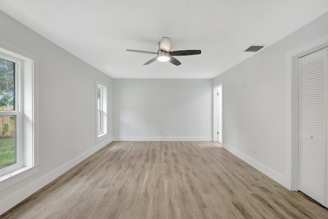 unfurnished room with ceiling fan and light hardwood / wood-style floors