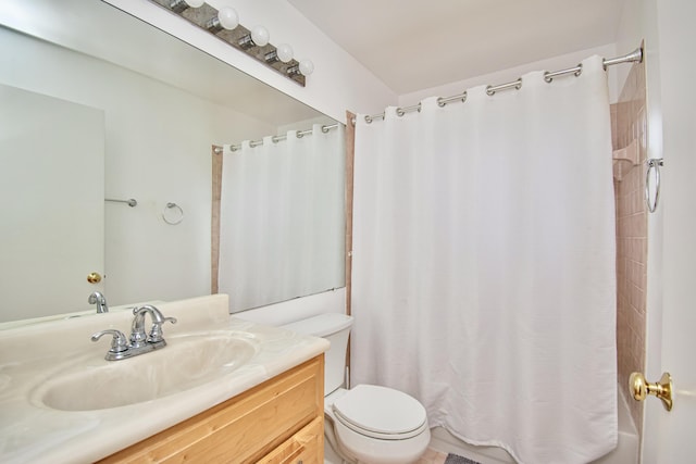 full bathroom featuring toilet, vanity, and shower / tub combo