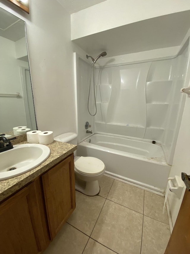 full bathroom featuring toilet, washtub / shower combination, tile patterned floors, and vanity