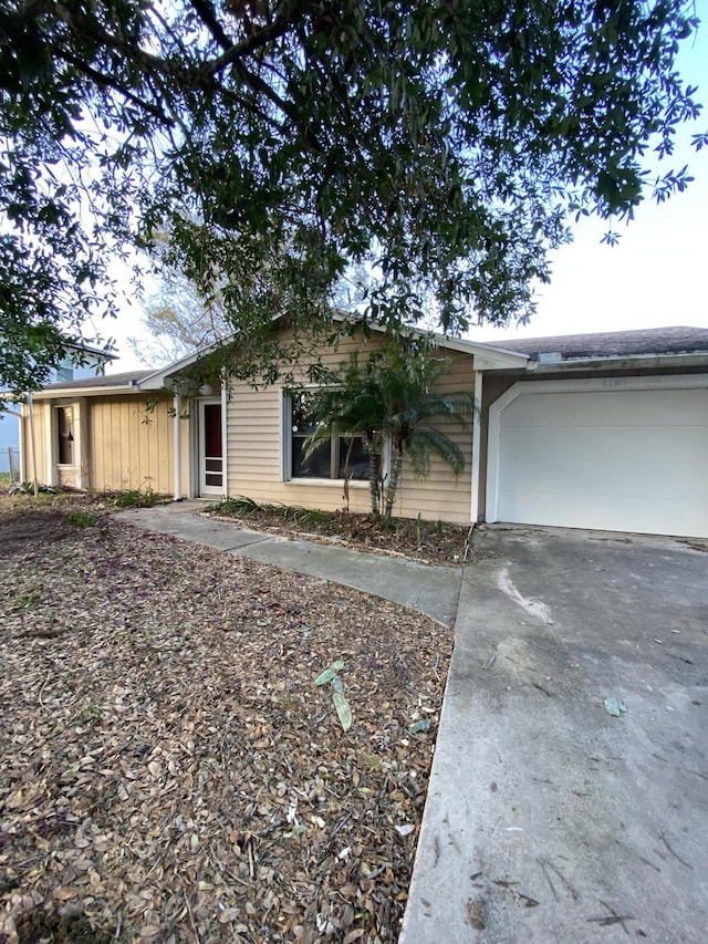 single story home featuring a garage