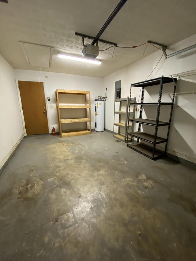 garage featuring electric water heater and a garage door opener