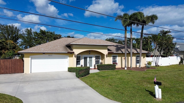 ranch-style house with a front lawn and a garage