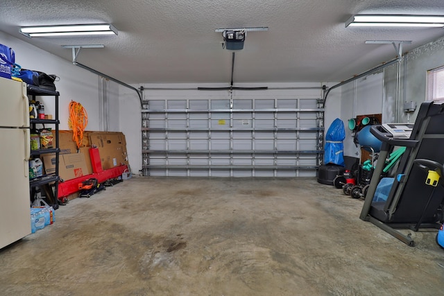 garage featuring white fridge