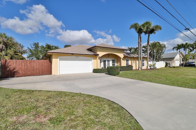 view of front facade with a front lawn and a garage