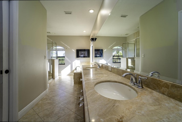 bathroom with tile patterned floors and vanity