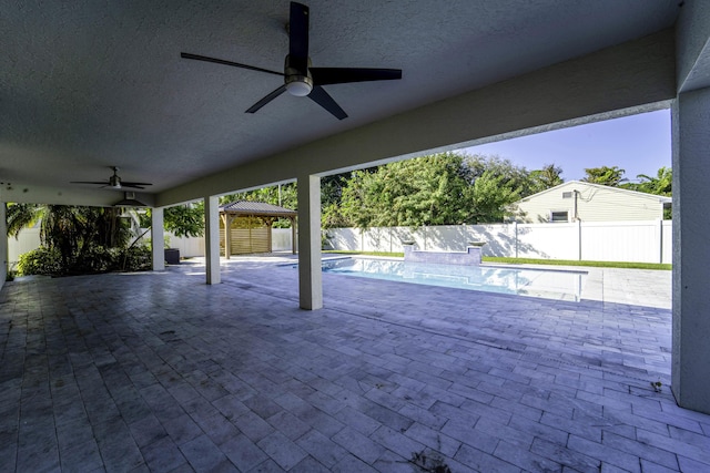 view of patio with a gazebo and ceiling fan