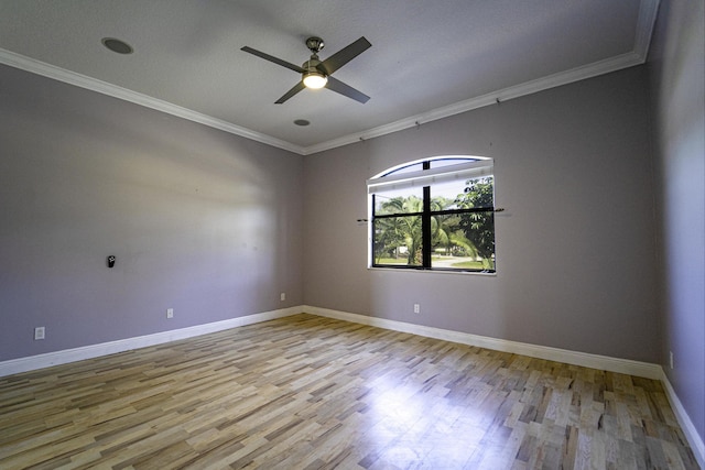 unfurnished room with crown molding, ceiling fan, and light hardwood / wood-style flooring