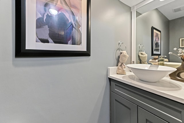 bathroom with visible vents and vanity