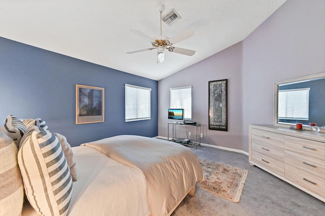 bedroom featuring baseboards, visible vents, a ceiling fan, vaulted ceiling, and dark carpet