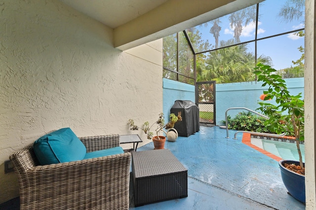 view of patio featuring a swimming pool, area for grilling, and a lanai